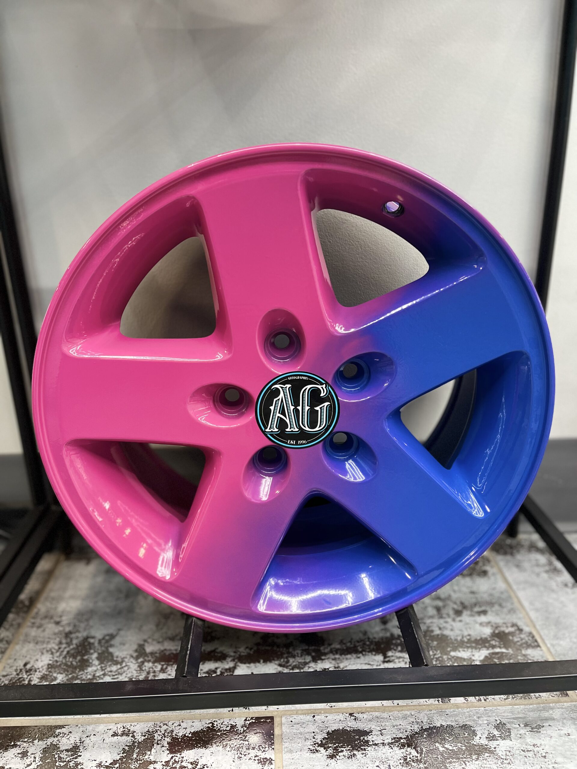 Pink and Blue Rims finished in Omaha, NE by Autographix using Powder Coating